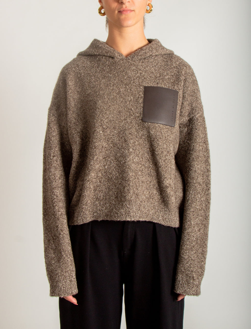 Maglia bouclé con cappuccio