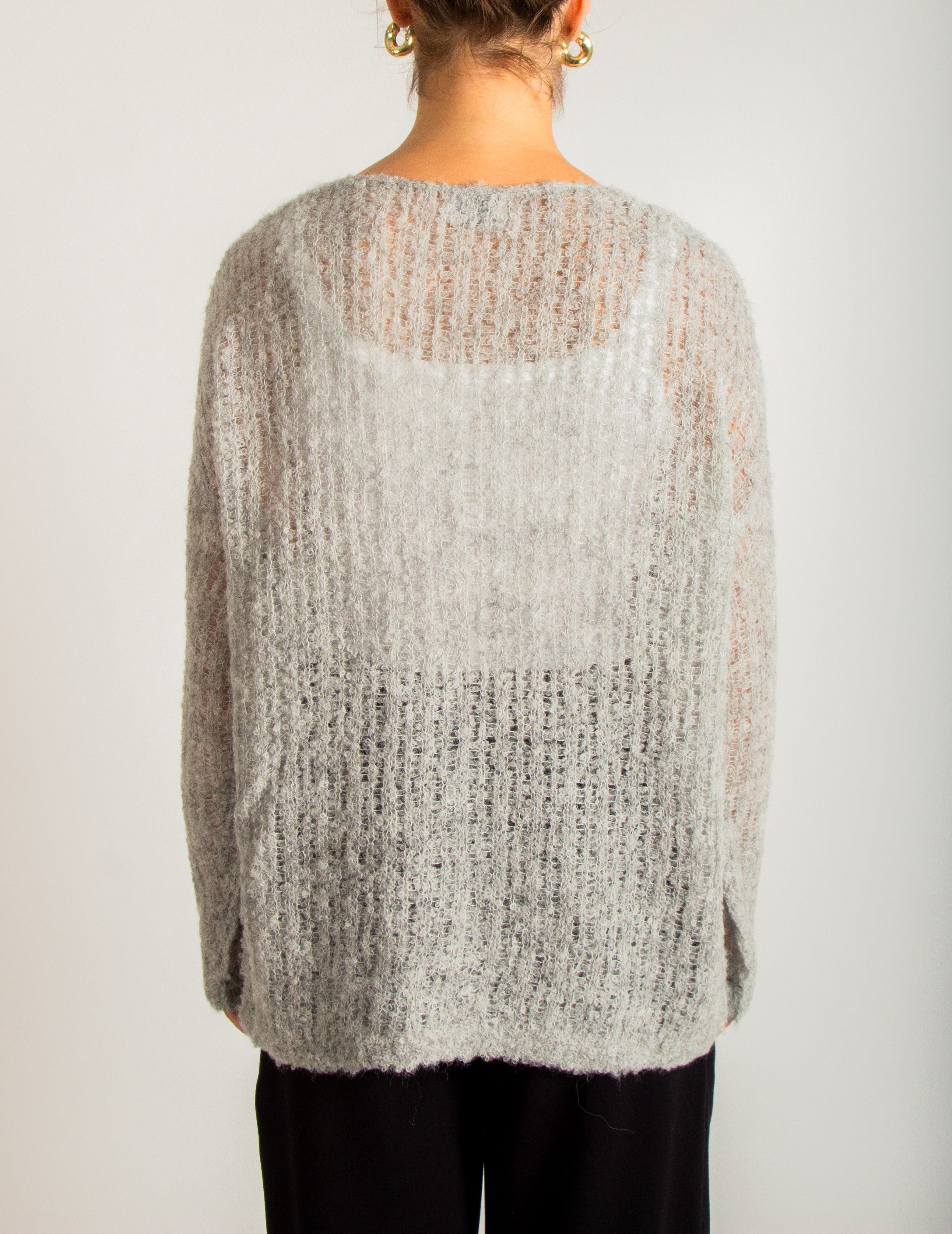 Maglia in filato garzato con lavorazione traforata